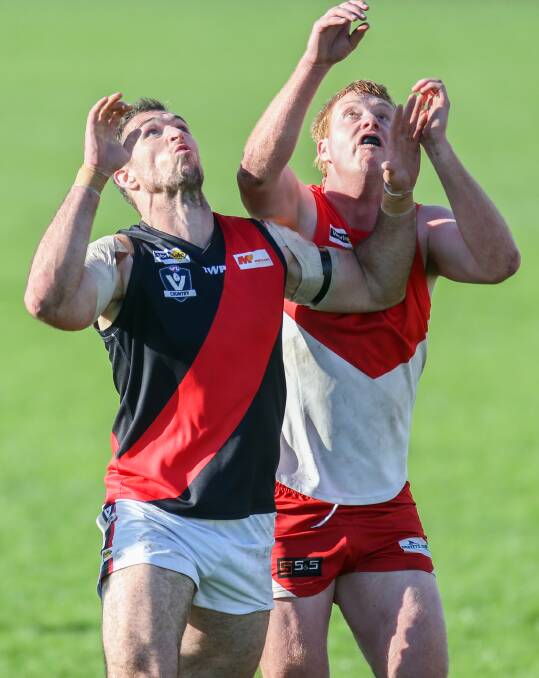 EYES ON THE BALL: Cobden ruckman Levi Dare and South Warrnambool ruckman Manny Sandow make their presence felt at a throw in. Picture: Amy Paton