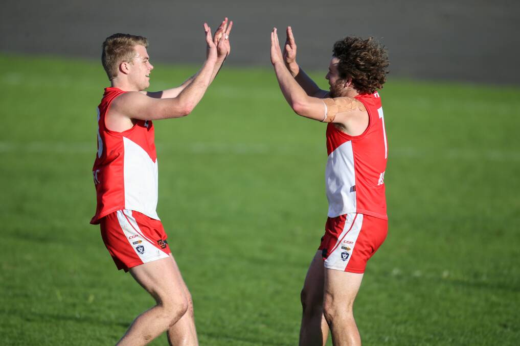 CELEBRATION TIME: South Warrnambool players Shannon Beks and Sam Thompson were pumped after a goal against Cobden on Saturday. Picture: Amy Paton