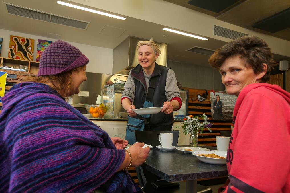 EAT UP: Kulcha Shift Friday Feed manager Rita Burns serves a meal to Sharon Taylor (left) and Karen Budgeon, both of Warrnambool, as part of Kulcha Shift’s Friday Feed. Picture: Rob Gunstone