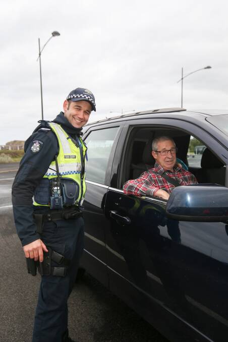 CHECK UP: Warrnambool police officer Senior Constable Peter Hunter with Mortlake's Rob Cargeeg whose vehicle was declared safe at the free check. Picture: Amy Paton