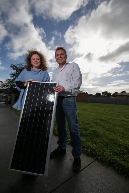 It's Lit: Warrnambool City Council mayor Kylie Gaston and John Moylan with one of the new solar lights that will be installed. Picture: Rob Gunstone