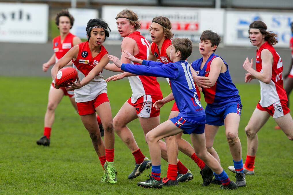 WEAVING OUT OF TRAFFIC: South Warrnambool's Cyrus Fenn in action for the finals-bound Roosters. Picture: Rob Gunstone