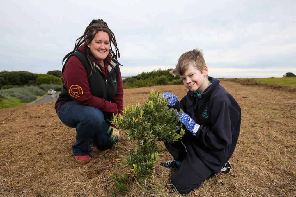 Green thumb: Warrnambool Coastcare Landcare Network volunteer Erin Gundry with her son Austin Gundry-Morrison, 9. They want people to join them for the National Tree Day Reveg the Flume event on Sunday. Picture: Rob Gunstone