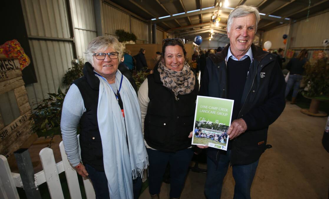Book launch: Lyne-Camp Creek Landcare Group members Sue Baulch, Alice Hall and Rob Stewart with the new book documenting the group's work. Picture: Morgan Hancock