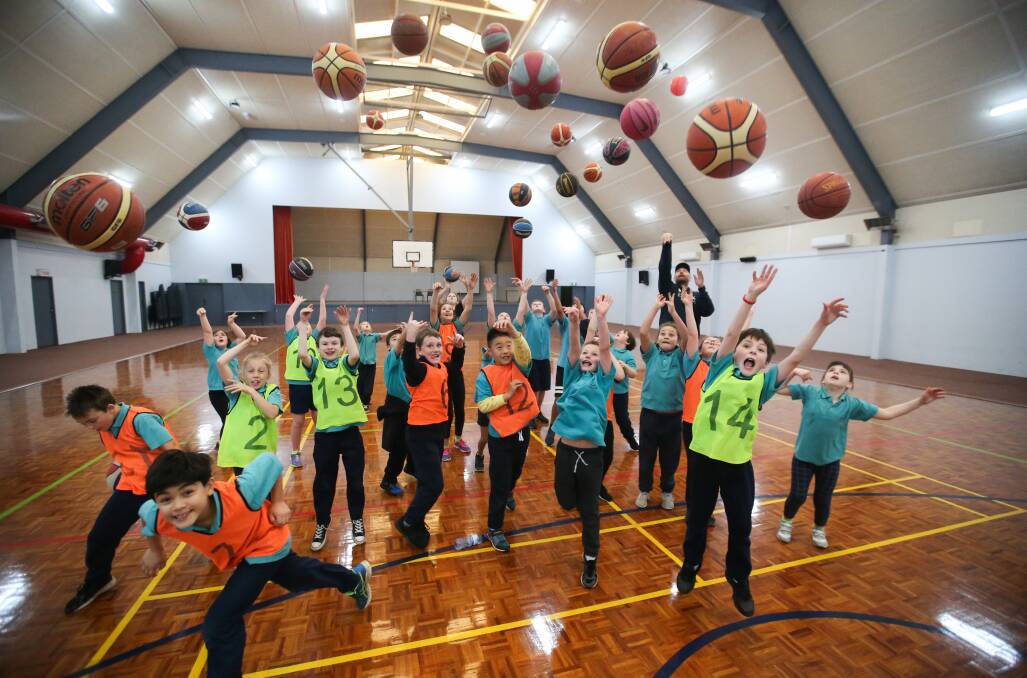 HAVING AN ABSOLUTE BALL: Pupils from Warrnambool West Primary School are enjoying a basketball program with Seahawks coach Matt Alexander. Picture: Morgan Hancock