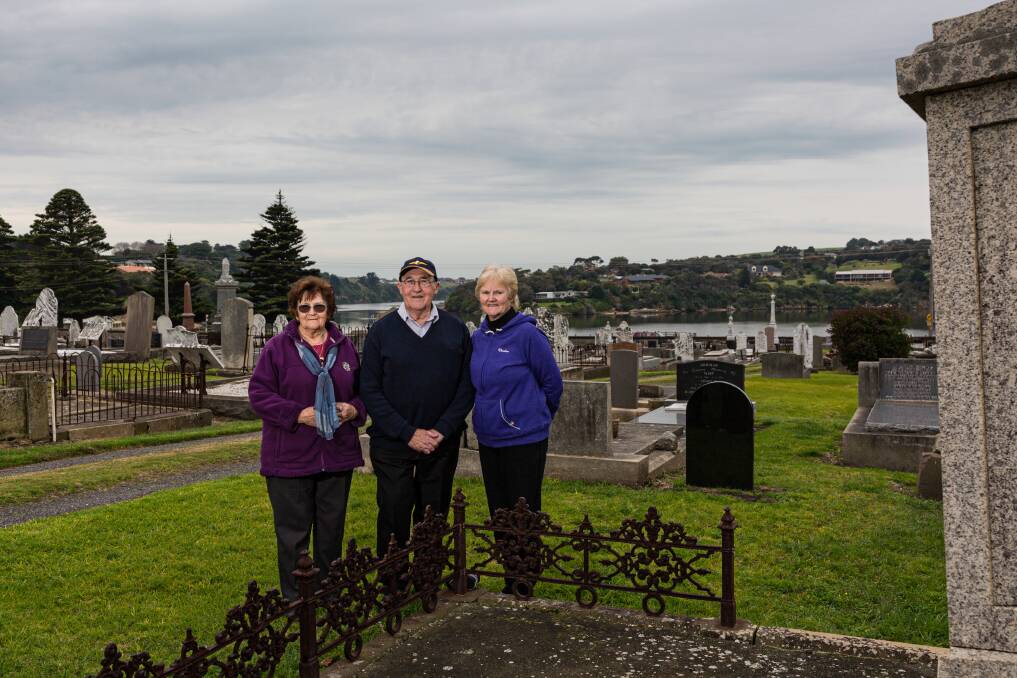 Family project: Yvonne Greenwood, Jeffrey Everitt and Margaret O'Donnell at the gravestone of family descendant George Levi, one of Warrnambool's original settlers.  