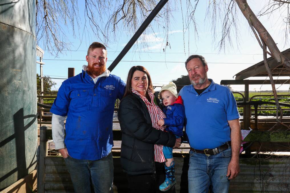 CHANGING: Tom Britnell, Roma Britnell holding grandson Archie, 18 months, and Glenn Britnell at their Woolsthorpe dairy farm. After 12 years with Murray Goulburn, they are swapping milk processers. Picture: Rob Gunstone