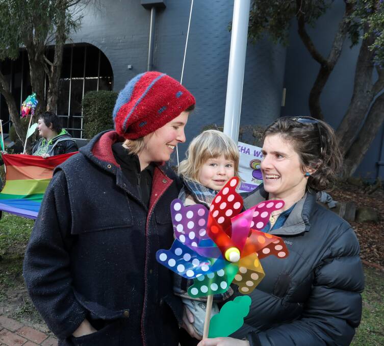 Emotional: Warrnambool couple Claire Bishop and Tina Reilly, with their son, were moved to tears at the ceremony.
