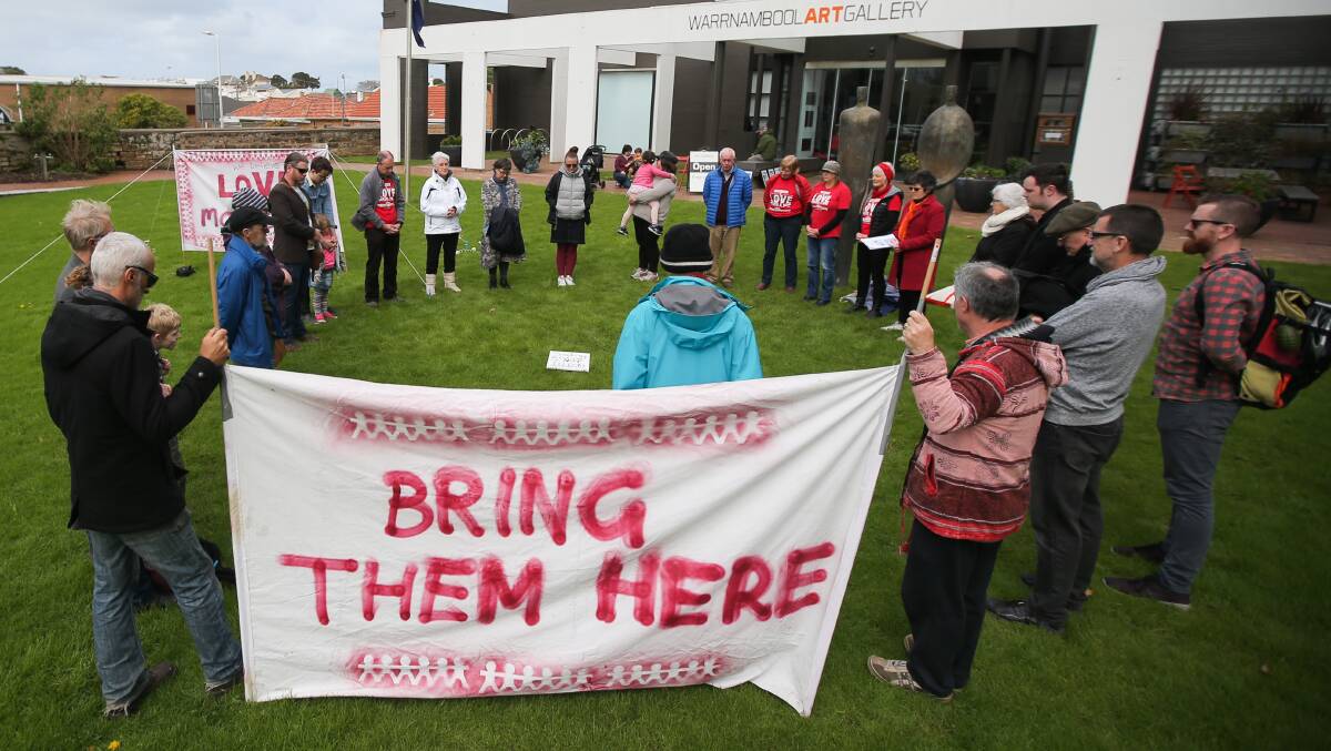 Call for compassion: Love Makes A Way south-west members at a gathering on Warrnambool's Civic Green earlier this month. Picture: Morgan Hancock