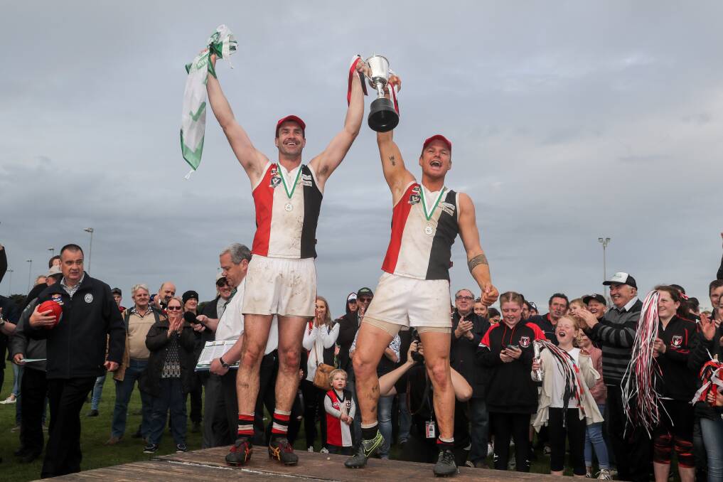 HERE IT IS: Koroit coach Chris McLaren and captain Isaac Templeton show off the Saints' latest piece of silverware to their loyal fans. The Saints have won four flags in succession. Picture: Rob Gunstone