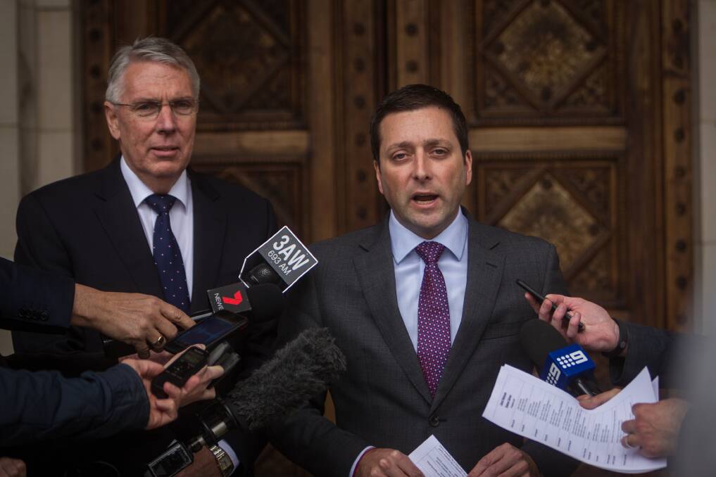 Opposition leader Matthew Guy along with Peter Walsh announcing a new shadow ministerial line up. Photo: Scott McNaughton