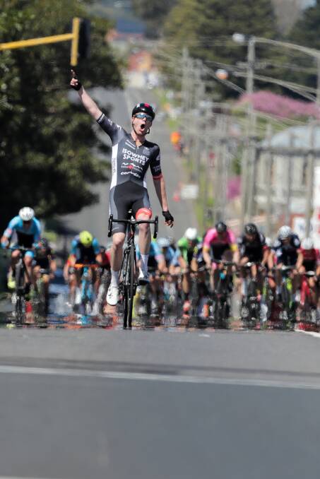 Nathan Elliott celebrates as he crosses the finish line to become the first rider to win the Melbourne to Warrnambool two years running. Picture: Rob Gunstone