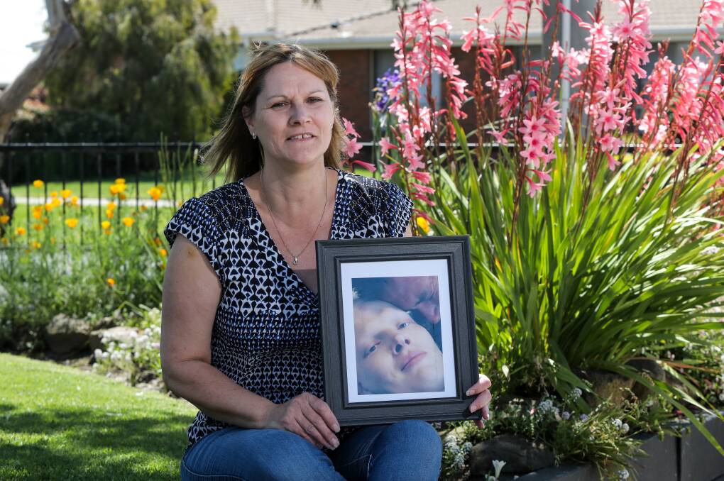 Stepping out: Warrnambool's Andrea Lyon, holding a photo of her son Aaron, is joining the Peter McCallum Cancer Centre One Day to Conquer Cancer walk again this year. Picture: Rob Gunstone