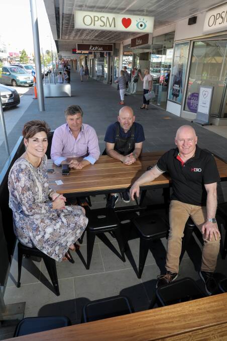 POSITIVE: Warrnambool City councillors Sue Cassidy, Tony Herbert, and Peter Hulin talk with Mark Brightwell, from Brightbird Espresso. Picture: Rob Gunstone