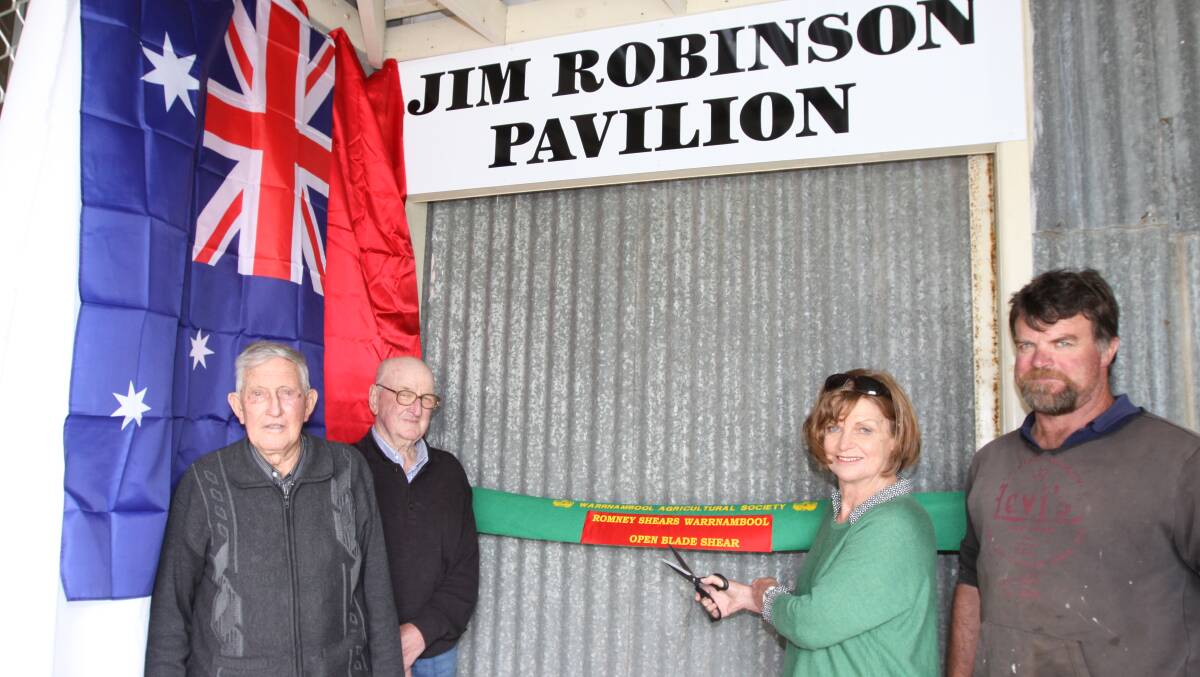 Honoured: The wife of the late Jim Robinson, Sue, and son Sam, cut the ribbon on the Jim Robinson Pavilion at the Warrnambool showgrounds with veteran show committee members Graeme Ross and Vic Ludeman.