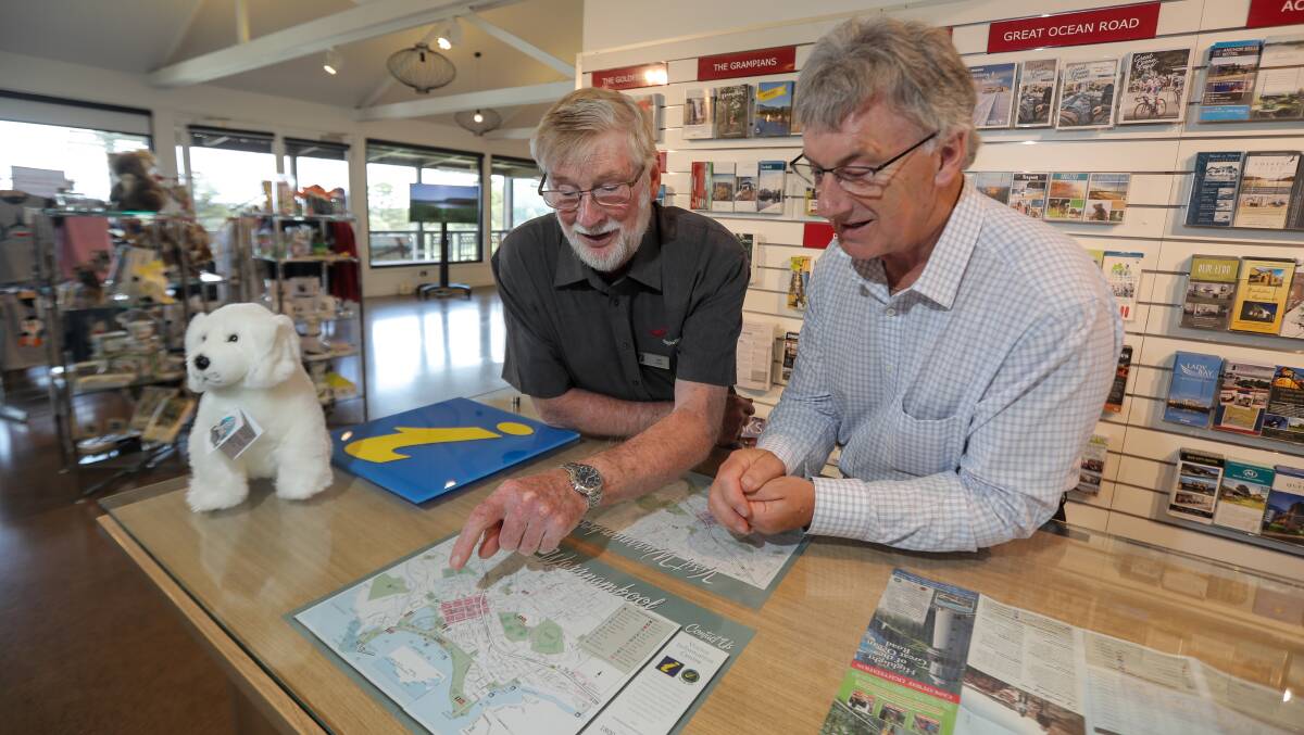 On the map: Warrnambool Visitor Information Centre volunteer Leo Ryan points out some of the city's highlights to mayor Robert Anderson. More people like Mr Ryan are needed to boost volunteer ranks. Picture: Rob Gunstone