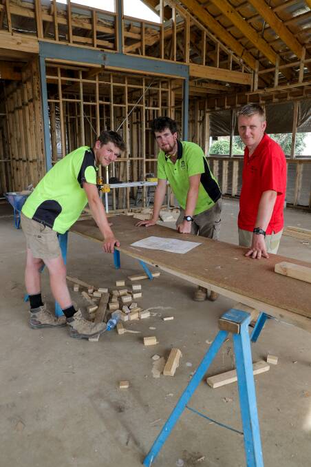 ON THE JOB: School-based apprentice James Coomber, carpenter Ryan Mitchell and Bolden Constructions director Leigh Dufty at a building site. Picture: Rob Gunstone