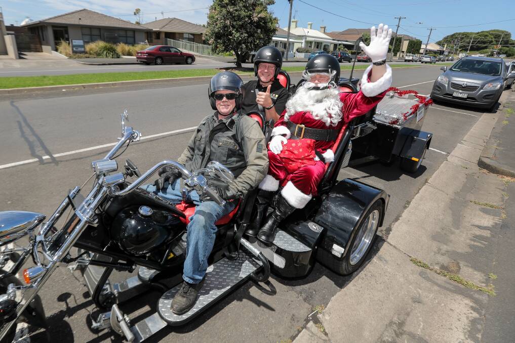 On tour: Warrnambool and District Food Share's Dedy Friebe and Santa go for a ride with Don King, from Down Under Trike Tours, to help promote Food Share's Christmas  Appeal. Picture: Rob Gunstone