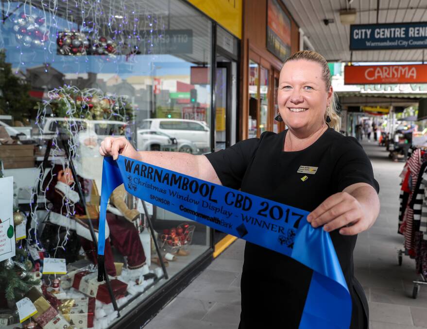 Best display: Which business will receive the prize from Commonwealth Bank Warrnambool branch customer service manager Adele Griffin for their Christmas window on Thursday night? Picture: Rob Gunstone