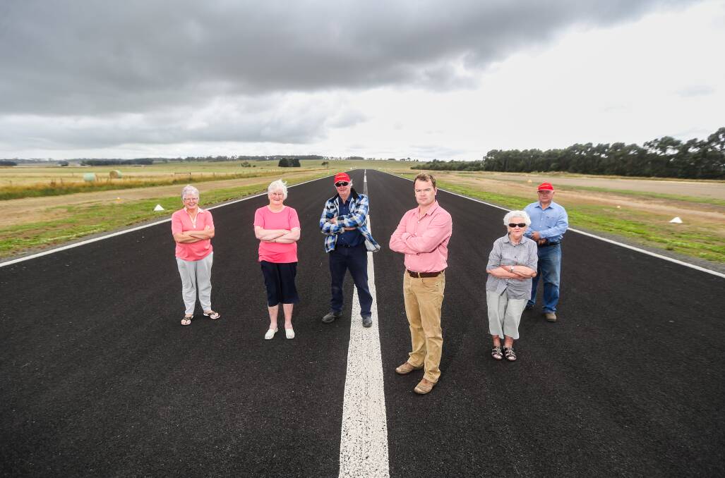 Taking a stand: Jan O'Connell, Eunie Dawe, Paul Moloney, Warren Ponting, Helen Watts and Stan Williams on the runway at Cobden airport. Picture: Morgan Hancock