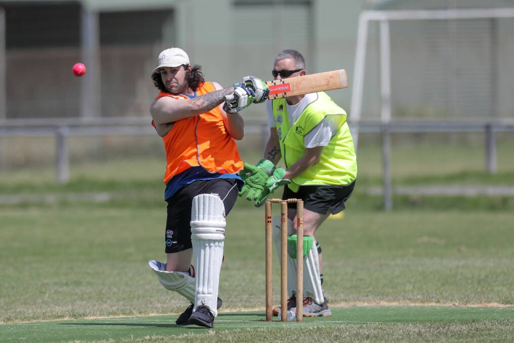 Friendly Rivalry: Lore batter Jackson Chatfield flat bats the ball to the boundary, in front of Law keeper Acting Sergeant Andrew McOrist, as his side builds a strong total in the annual match. Picture: Rob Gunstone