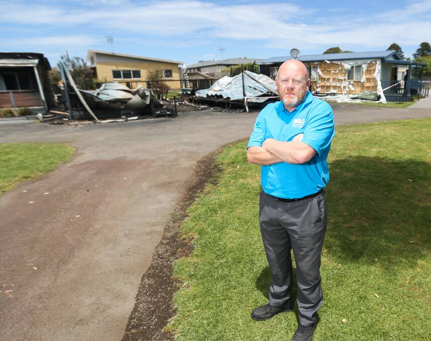 BIG MESS TO CLEAN UP: Port Fairy's Big 4 caravan park manager Rohan Doherty in front of the destroyed cabins at the popular family site. Picture: Morgan Hancock