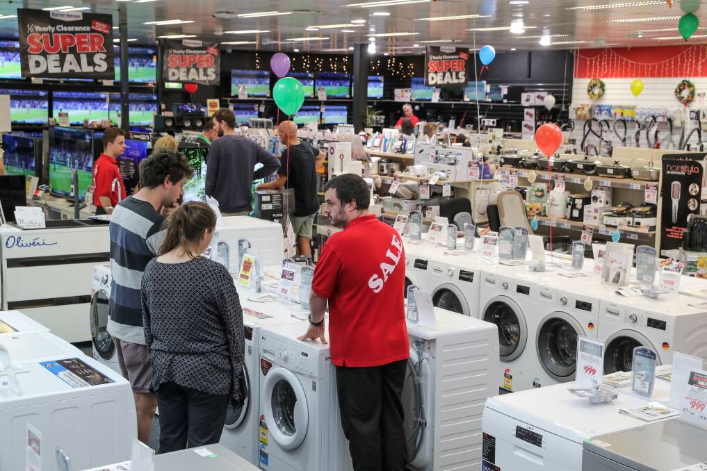 Staff at Harvey Norman deal with the crowds of customers looking for a bargain on Boxing Day. Picture: Rob Gunstone