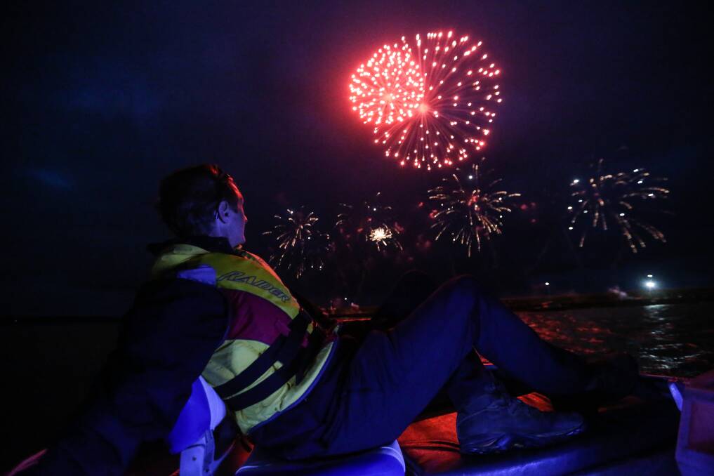 Best vantage point: On water security officer Troy Kersten from Southern Cross Fireworks looks watches the fireworks from his boat at the Breakwater on NEw Year's Eve. Picture Christine Ansorge