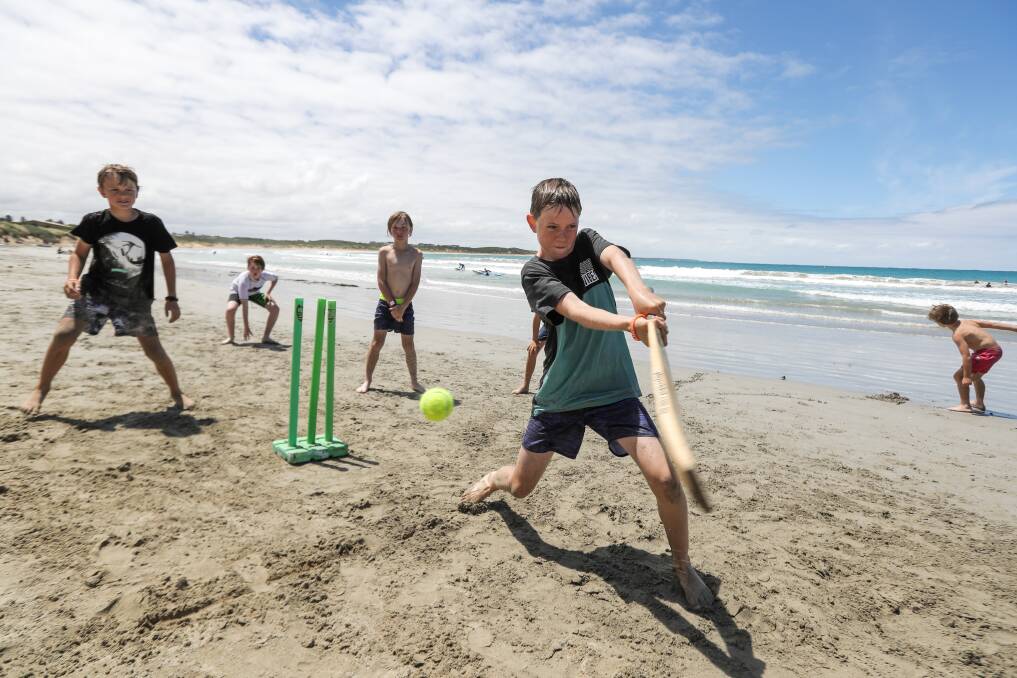 BEACHFEST: Warrnambool's Harry Jenkins, 11, swings hard at the ball during a beach cricket game. Picture: Rob Gunstone