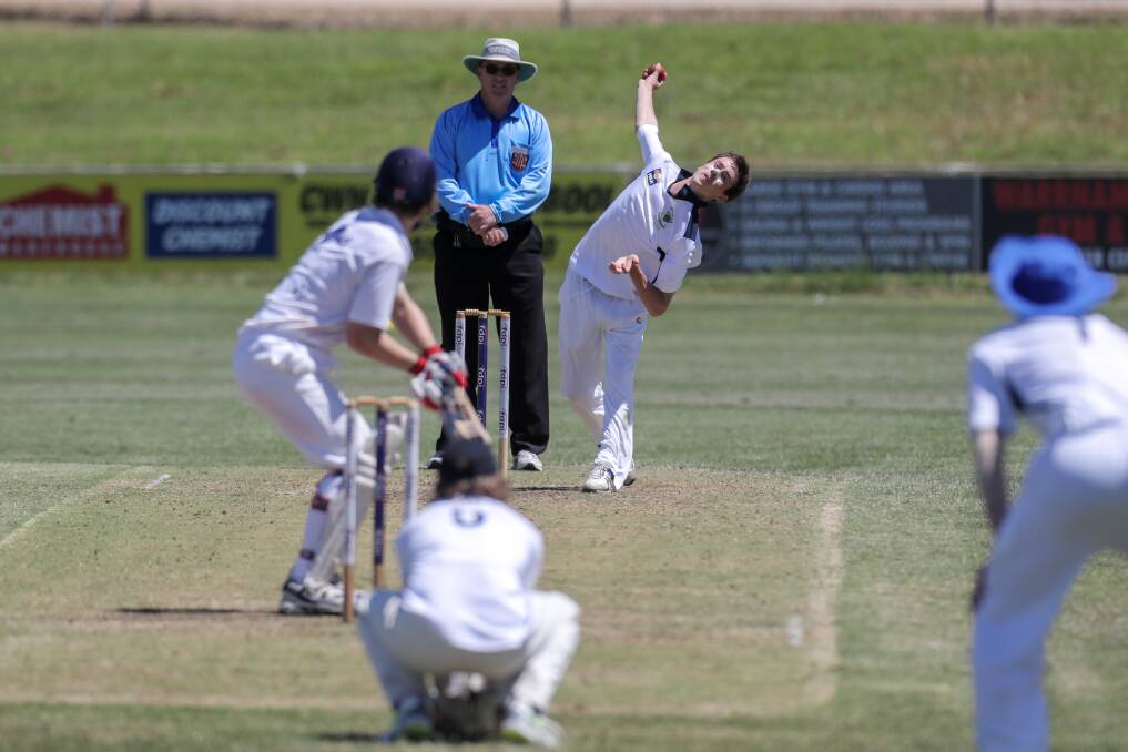 Warrnambool bowler Nick Robertson bends his back. Picture: Rob Gunstone
