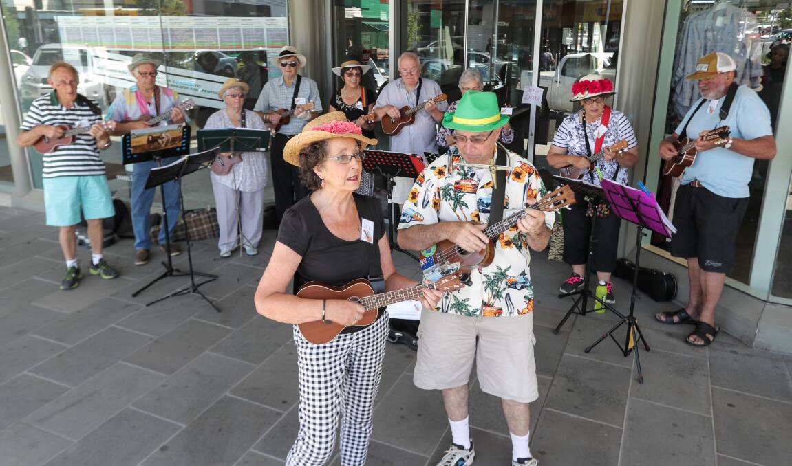 In tune: Anne Rea and Allan Wood come to the front with The Happy Ukes as they  perform along Liebig Street to help raise money for charity. Picture: Rob Gunstone