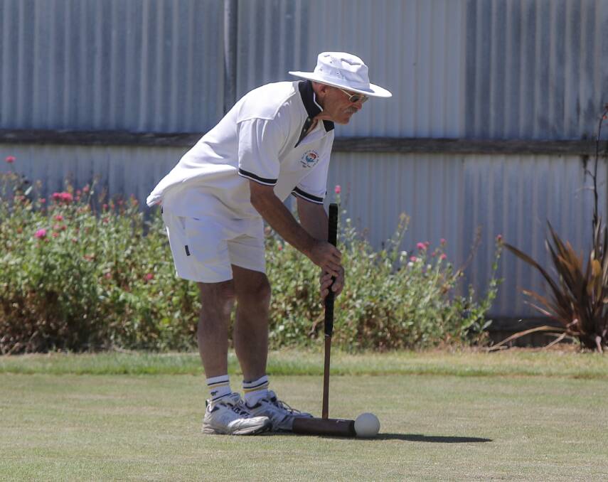 CHAMPION: Bendigo's Roger Bird plays the ball during his final round at the Warrnambool croquet tournament. Picture: Rob Gunstone