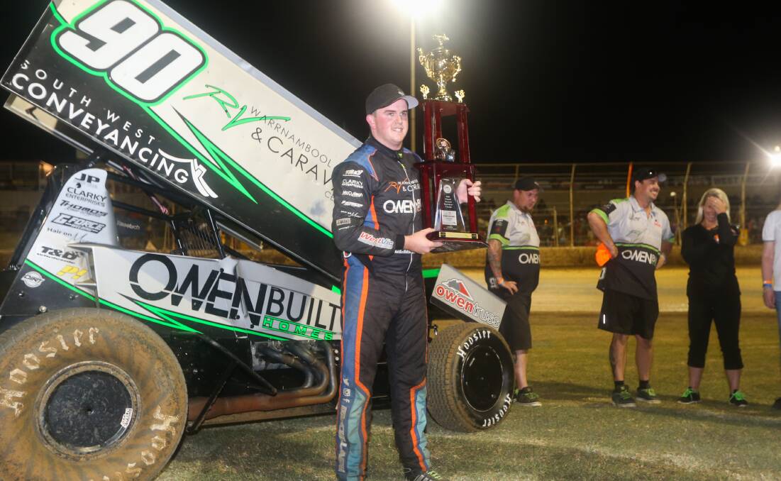 HOW GOOD IS THIS: Corey McCullagh shows off his trophy after winning the Grand Annual Sprint Car Classic.