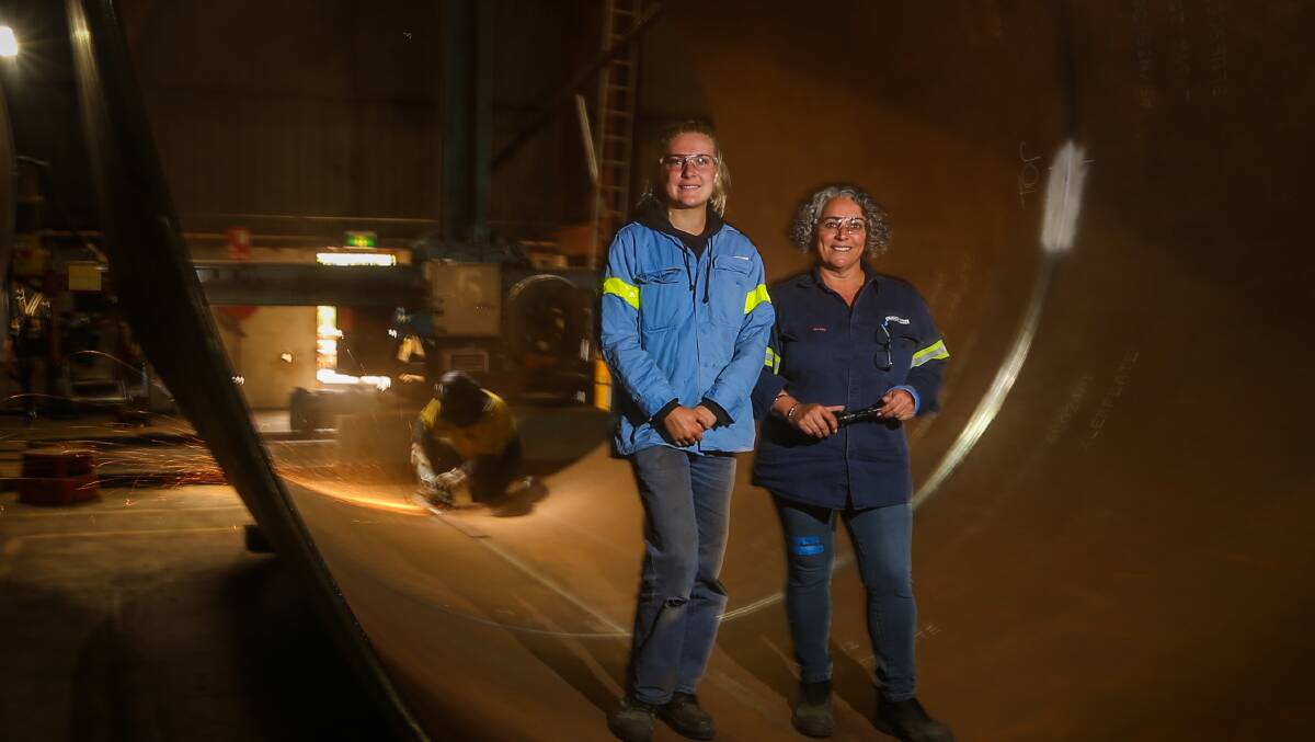 Women on the factory floor: Rachael McKenna and Trinidad Diaz work with more than 90 men on the factory floor at Keppel Prince making towers for wind turbines. Picture: Morgan Hancock