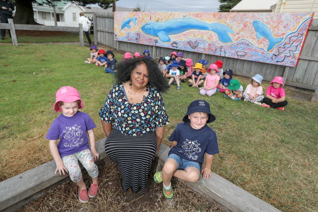 IMPRESSIVE: South Warrnambool kindergarten students Maggie Corbett, 5, and Harry Greenwood, 4, with artist Fiona Clarke, and the new mural she has painted next to the kinder. Picture: Rob Gunstone