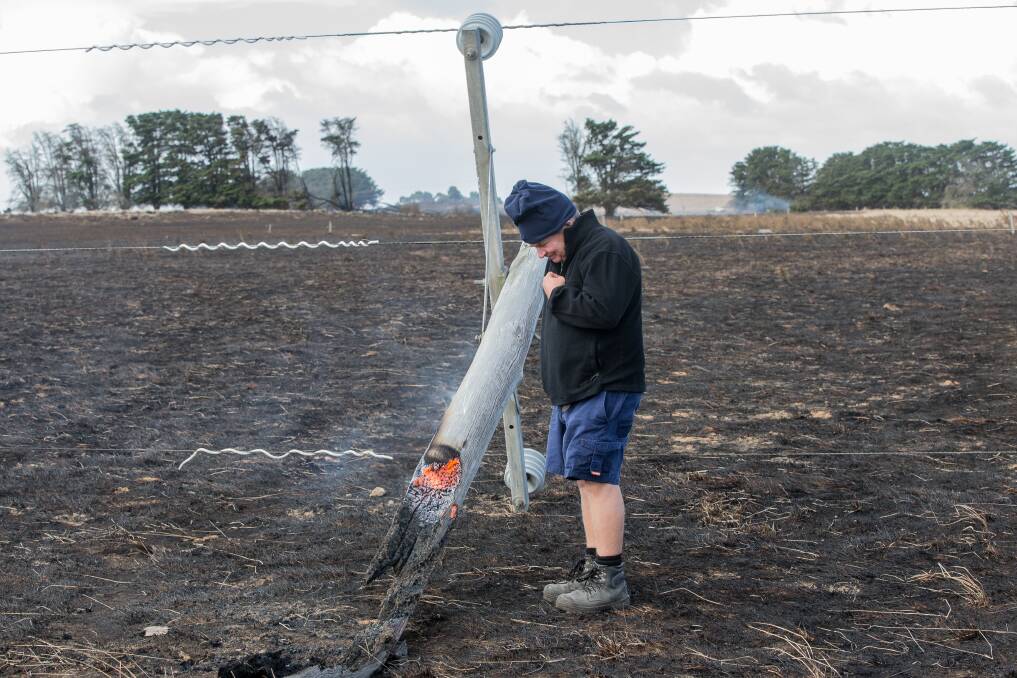 Jack Kenna inspects part of his property burnt in The Sisters Fire.  Picture: Christine Ansorge