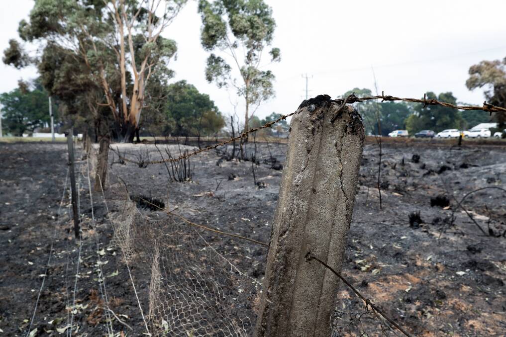 The remains of a fence after fire swept through farmland around Cobden. Picture: Rob Gunstone