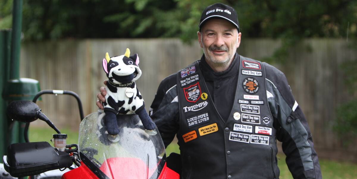RIDE TO REMEMBER: Black Dog rider Neil Wiltshire, with mascot Winston, is raising awareness of depression in the farming industry. Picture: Anthony Brady