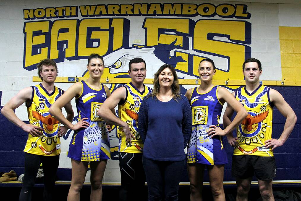 North Warrnambool Eagles' Felix Jones, Victoria Grundy, Jack Johnstone, Maddison Vardy and Jackson Grundy with artist Sherry Johnstone (fourth from left) with her design in 2023. File picture 