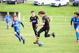 Warrnambool Wolves Blacks Luca Rogers shows some fancy footwork in a South West Victoria Football Association under-14 match in 2023. Picture by Eddie Guerrero 
