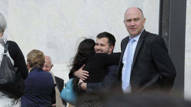 Harlan Agresti hugs members of his family outside court. Photo: Alexandra Back