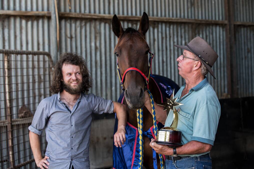 CHAMPION: Patrick and John Meade with star horse Sparkling Success, winner of the richest trotting race in Australiasia. Picture: Christine Ansorge