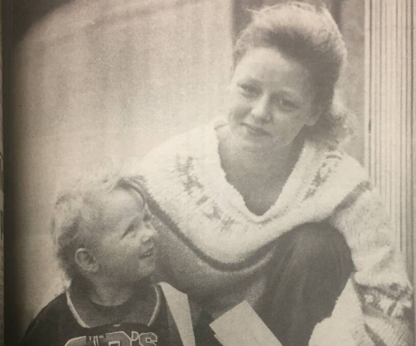 HAPPY: Tammy Lavithis, 18, of Warrnambool shares the good news of her VCE pass with her two-and-a-half-year-old Daniel in January 1992. 