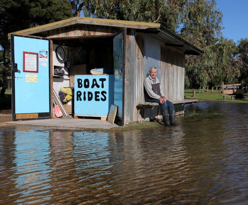 Rising water: Warrnambool boat operator Ken Hooke says a blocked Merri River has caused the water levels to rise in Lake Pertobe, making it difficult to run his business. Picture: Rob Gunstone