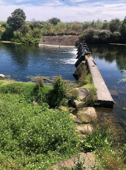 The weir wall before it was removed in recent weeks. It has led to water levels dropping in parts of the river. Picture supplied