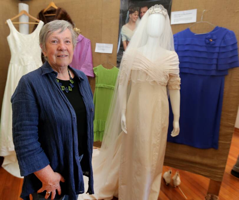 Fashions through the ages: Anne Adams with some of the wedding gowns on display. Picture: Amy Paton