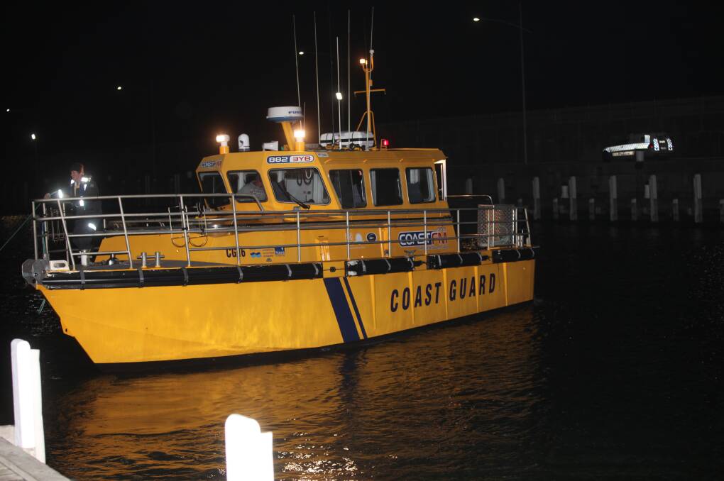 The Warrnambool Coast Guard vessel tows the man's boat back to the Warrnambool boat ramp about 10.20pm on Sunday