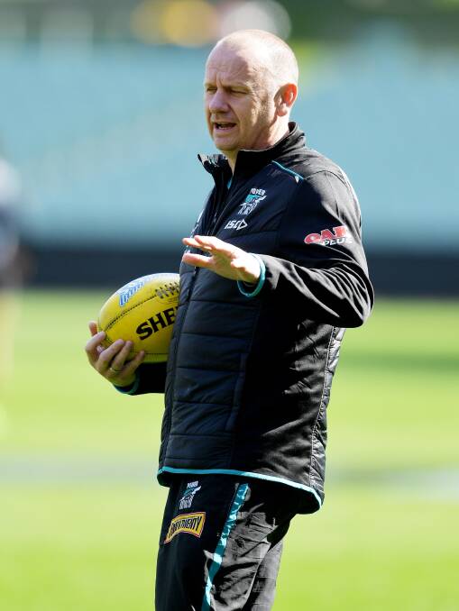 TEACHING: Port Adelaide coach Ken Hinkley is seen during a training session at Adelaide Oval. Picture: AAP Image/David Mariuz