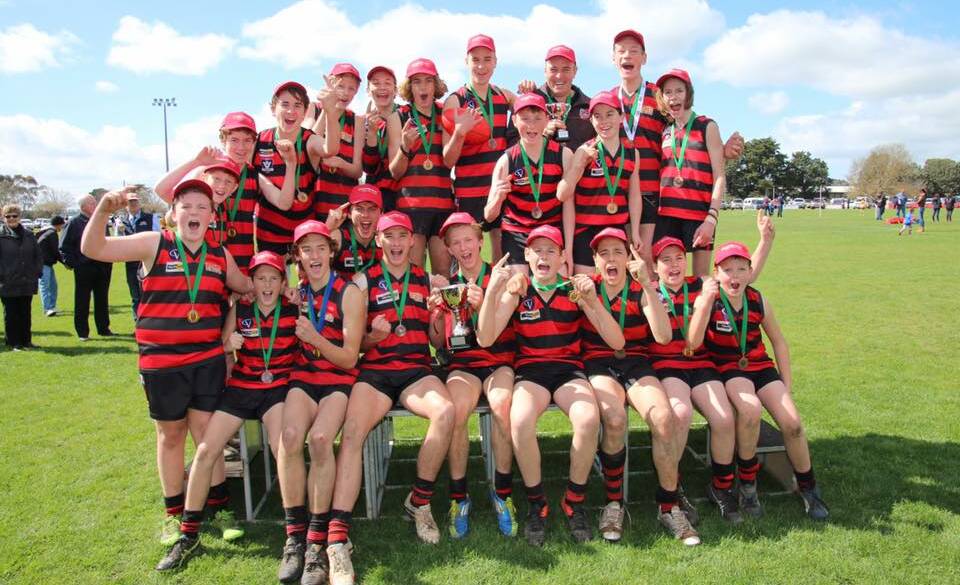 WINNERS ARE GRINNERS: Penshurst's under 16.5 side celebrates its junior premiership win over Hawkesdale-Macarthur. Picture: Tracey Kruger
