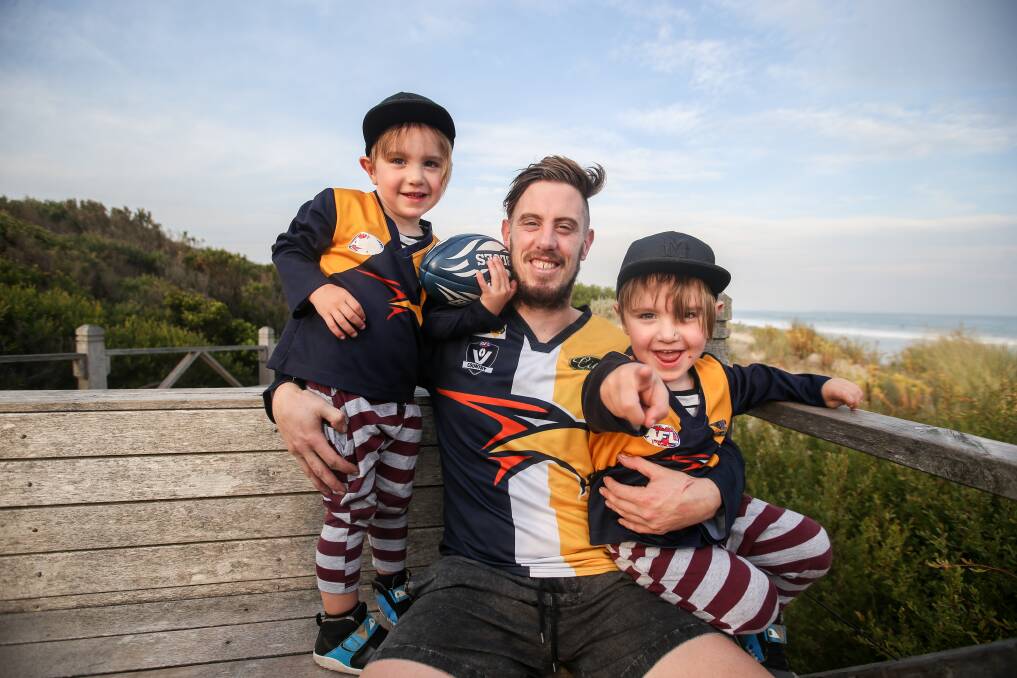MILESTONE: North
Warrnambool Eagles'
midfielder Xavier Mills
pictured with twin sons
Ruben and Max.
Picture: Amy Paton
